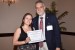 Prof. Andrés Tremante giving Prof. Laura M. Londoño Vásquez the best paper award certificate of the session "Gestión Organizacional." The title of the awarded paper is "Modelos de Confianza, Análisis desde la Organización."